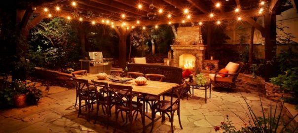 night photograph of outdoor kitchen and patio