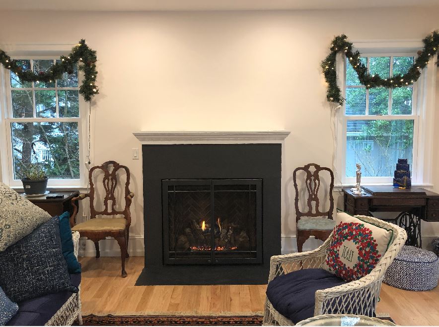 black fireplace on a white wall