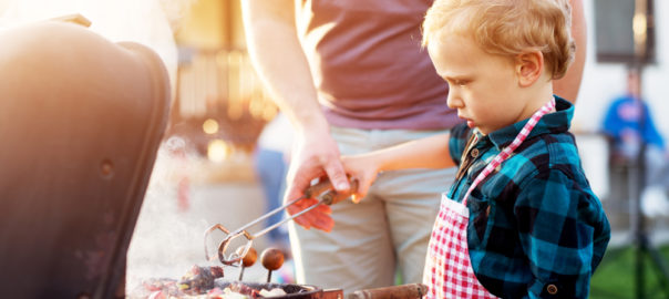 child at grill