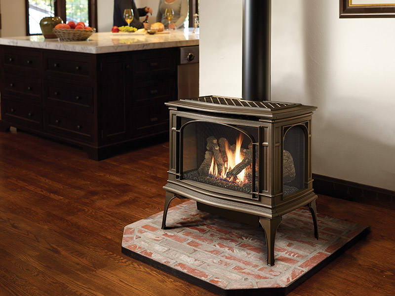 Greenfield Bay Window stand-alone gas heating stove near a kitchen island