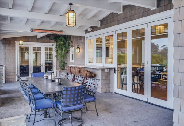 An image of a patio with an outdoor electric heater in the rafters.