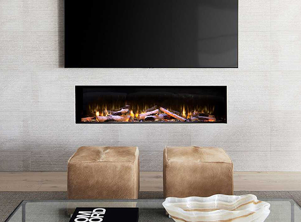 A photo of a fireplace in a white wall, underneath a mounted television