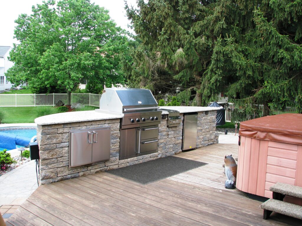 An outdoor kitchen island with a built-in grill.