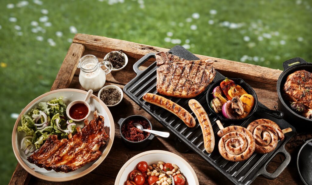 various grilled foods arranged on a table