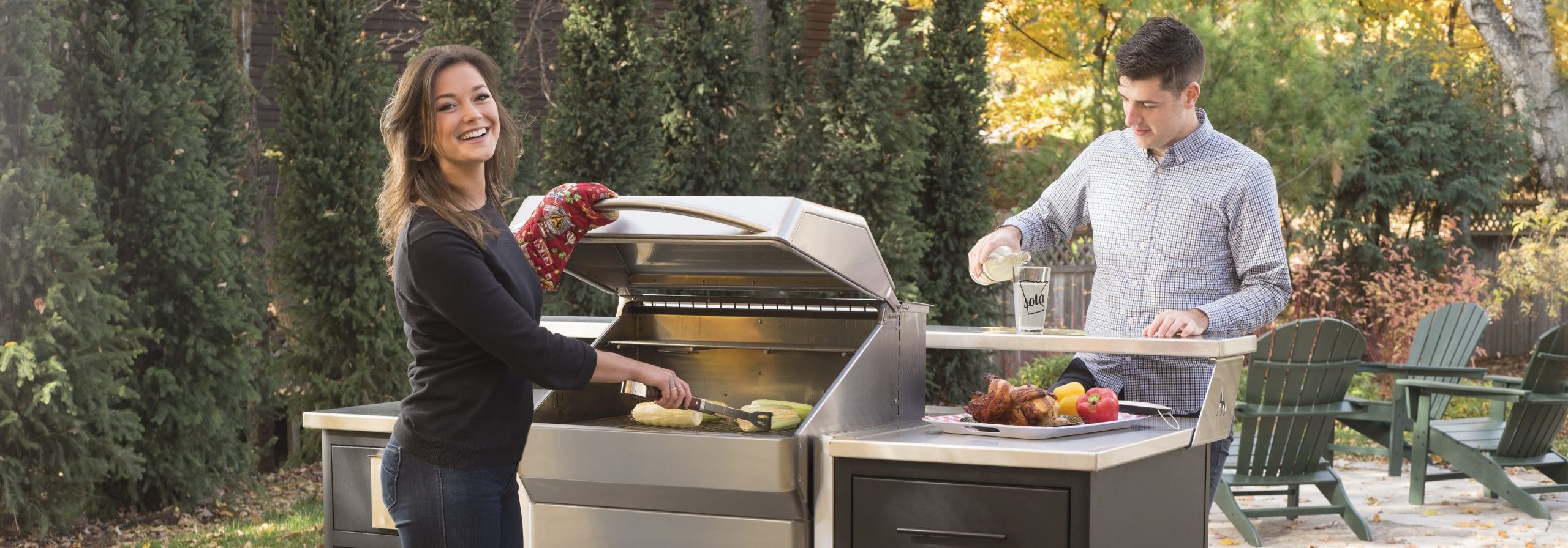 a couple grilling on a Memphis grill