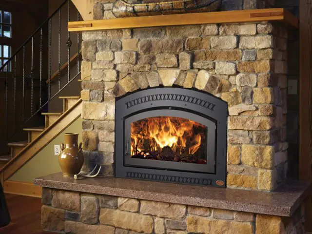 a fireplace with a stone setting